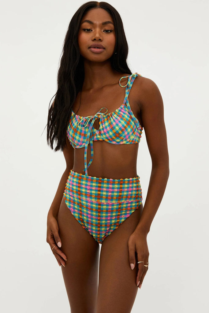 Model wearing the beach riot women's highway bikini bottom in sunny side gingham print