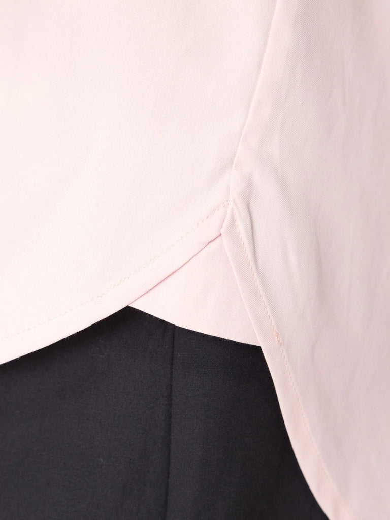 Detail photo of stitching and hem of the brochu walker the everyday shirt in rose quartz.